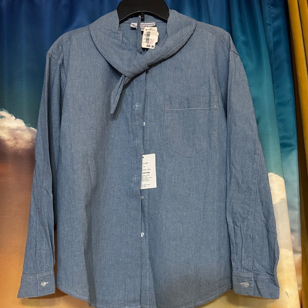 Vintage blue button-up shirt featuring a unique tie collar. Casual or formal.